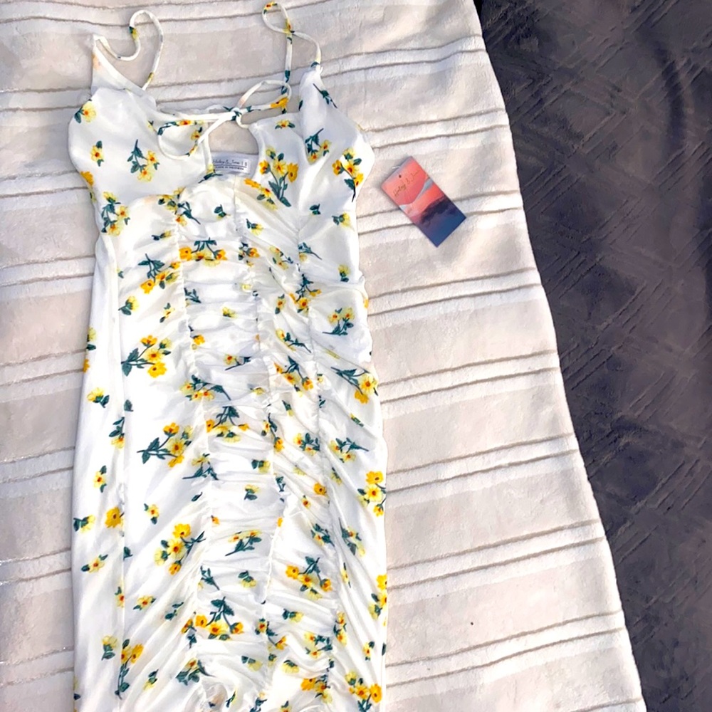 Size small, Made in Indonesia, tight fitting short dress